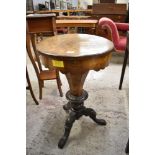 A Victorian figured walnut pedestal sewing table or workbox, of circular form, the tapering