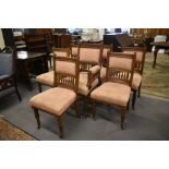 A set of seven Victorian mahogany salon chairs comprising a gentleman's armchair and six single