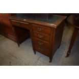 A small Victorian oak kneehole desk, the top with moulded edge detail over single drawer with