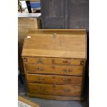 A 19th century light oak bureau of traditional design, some repairs and replacements. 116CM.