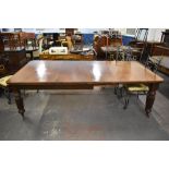 A Victorian mahogany extending dining table, of rectangular form with moulded edge detail and canted