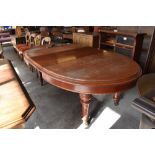 Victorian mahogany extending dining table, of rounded oblong form with moulded edge detail over