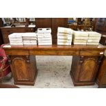 A Victorian figured mahogany pedestal sideboard, having three blind frieze drawers over arched