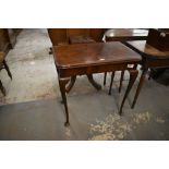 A 1920s figured walnut fold over card table, with typical swivel action and cabrial type supports