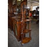 A Victorian inlaid walnut four tier corner whatnot, with fret cut and turned decoration. 145CM.