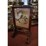 A Victorian rosewood firescreen with scrolled surmount over a tapestry depiction of Charles I and