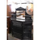 A Victorian aesthetic period ebonized wood credenza, of architectural form decorated with panels