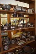 A large quantity of silver plated wares to include three piece tea sets, entree dishes. baskets.