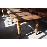 A Victorian mahogany extending dining table of canted rectangular form with moulded edge detail over