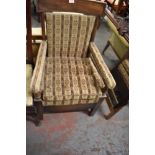 A late George III mahogany commode armchair, later upholstered. Seat height 42CM