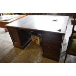 An early 20th century mahogany pedestal partners desk, of traditional arrangement with banks of