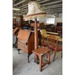 A 20th century Chinese carved hardwood standard lamp cum side table, carved in shallow relief with