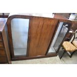 A 1930s mahogany side-by-side glazed display cabinet. 124CM. X. 133CM.