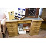 A Victorian Inverted breakfront light oak pedestal desk, with moulded edge detail and chamfered