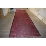A length of machine loomed carpet decorated with repeating fleur-de-lis design. 482CM.