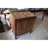 A 20th century Chinese carved hardwood cabinet, of rectangular form the top with double hinged doors