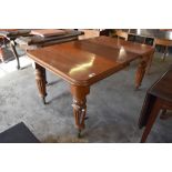 Victorian mahogany extending dining table of rounded rectangular form with moulded edge detail,