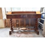 A Victorian mahogany washstand with three quarter gallery over two blind drawers, raised on barley