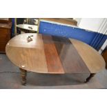 Victorian mahogany extending dining table, the D shaped ends enclosing two leaves and raised on