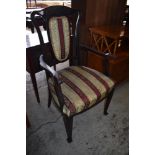 And Edwardian stained mahogany armchair, with Art Nouveau influenced design. Seat height. 47CM.