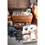 A 1940s oak chest of three drawers containing a variety of tools and fixtures, and a selection of