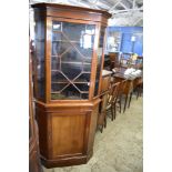 An Edwardian astragal glazed mahogany double corner cupboard, retailed by Sopwith and Co limited,
