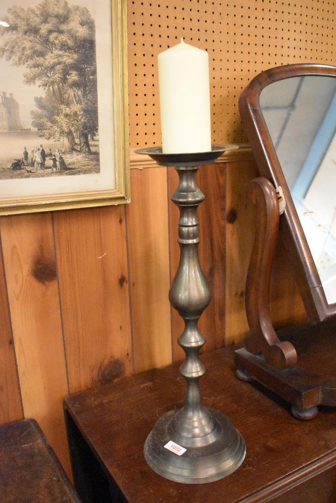 A cast metal pricket candlestick, of traditional turned design. 51CM.