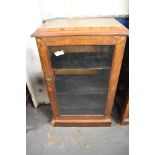 A late Victorian inlaid mahogany music cabinet, the glazed door with foliate inlaid spandrels.