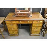 An Edwardian banded mahogany pedestal desk of traditional design