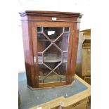 A small Edwardian mahogany astragal glazed corner cupboard. 75CM.