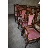 A set of six Edwardian inlaid mahogany dining chairs, comprising two carvers and four singles,