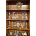 A quantity of mixed glasswares, comprising decanters, biscuit barrel, jug, vase, candlestick,