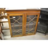 A 19th century astragal glazed mahogany bookcase top with dentil moulded cornice above a plain