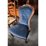 A Victorian mahogany spoonback nursing chair of traditional design. Seat height. 38CM.