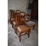 A group of three Victorian mahogany balloon back dining chairs sold together with a set of four