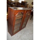 Victorian mahogany bookcase with two arched glazed doors 102cm Lacking surmount. One glass panel