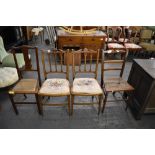 Two pairs of Edwardian bedroom chairs, one pair with inlaid banding, the other with caned seats