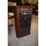 A Georgian inlaid mahogany and astragal glazed corner cupboard, with canted ends. 110cm