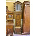 An early 20th century oak long case clock case, with Jacobean style geometric moulding. 223CM.