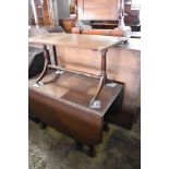 An early 20th century oak dropleaf gateleg table sold together with a reproduction mahogany coffee