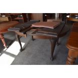 A 1920s mahogany extending dining table with D shaped ends and two additional leaves, and raised