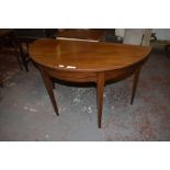 A 20th century mahogany D shaped table, raised on tapering square, section legs, Retaining table