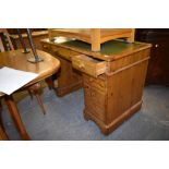 A modern Ducal pine twin pedestal desk, of traditional design with green tool leather skiver.