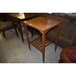 An Edwardian Arts and Crafts oak occasional table, with slatted under tier and casters. 76CM.