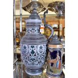 A large modern Rhenish pottery style stein, 37 CM sold together with a smaller German stein and