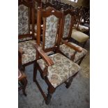A set of six Old Charm upholstered oak dining chairs, bearing label to underside and comprising