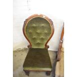 An unusual Victorian balloon back chair, the large spoon back with deep buttoned upholstery and