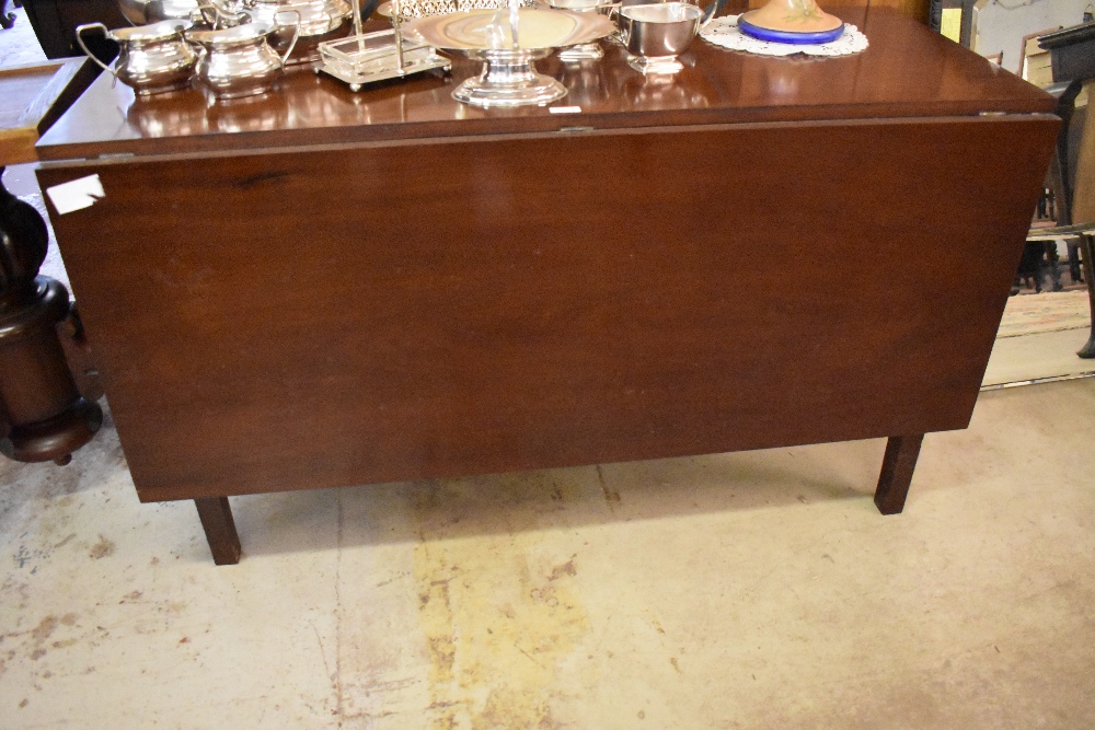 A 19th century mahogany drop leaf table, with gated support. 72CM X 124CM.