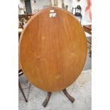 A Victorian Mahogany oval Loo table, of traditional design, with five turned supporting columns