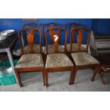 A set of six Edwardian mahogany dining chairs, having square section uprights and central vase